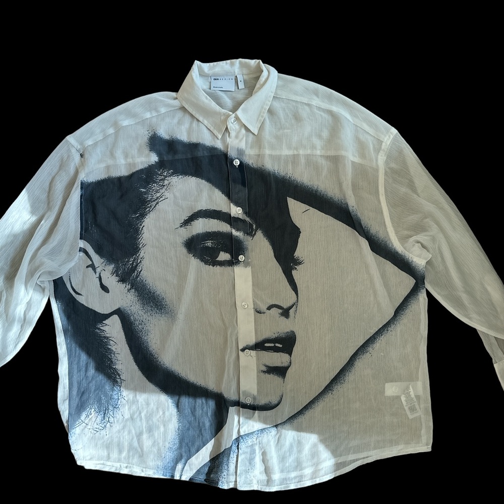 ASOS DESIGNED oversized sheer shirt with face graphics.